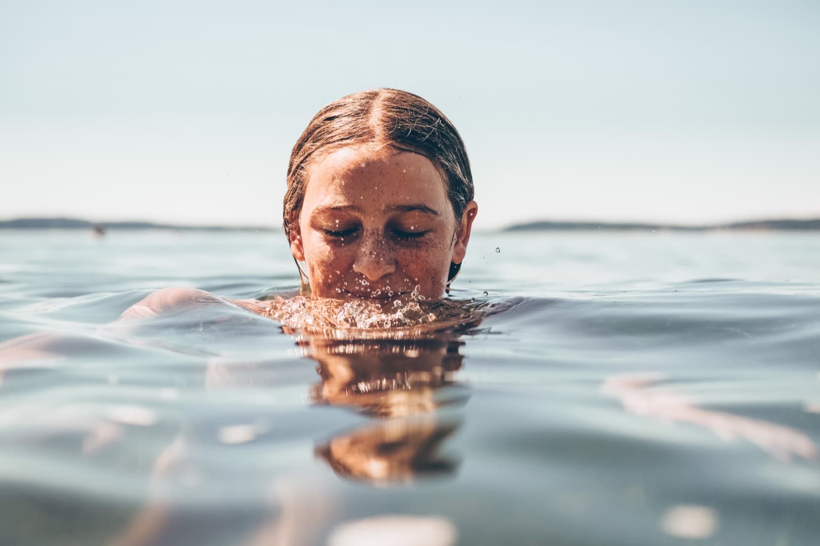 Open water swimmer building confidence close to shore